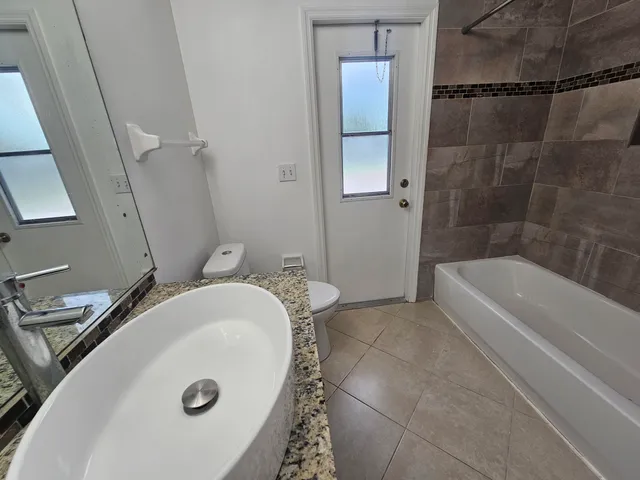 a front view of house with yard and trees