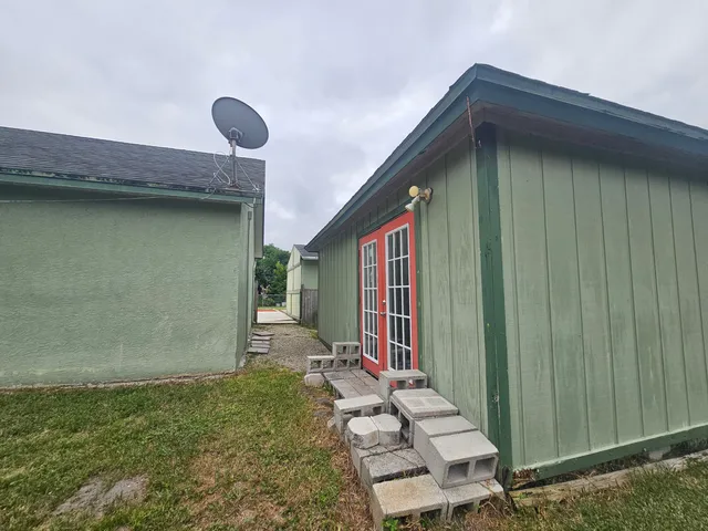 a view of a room with wooden floor and white walls