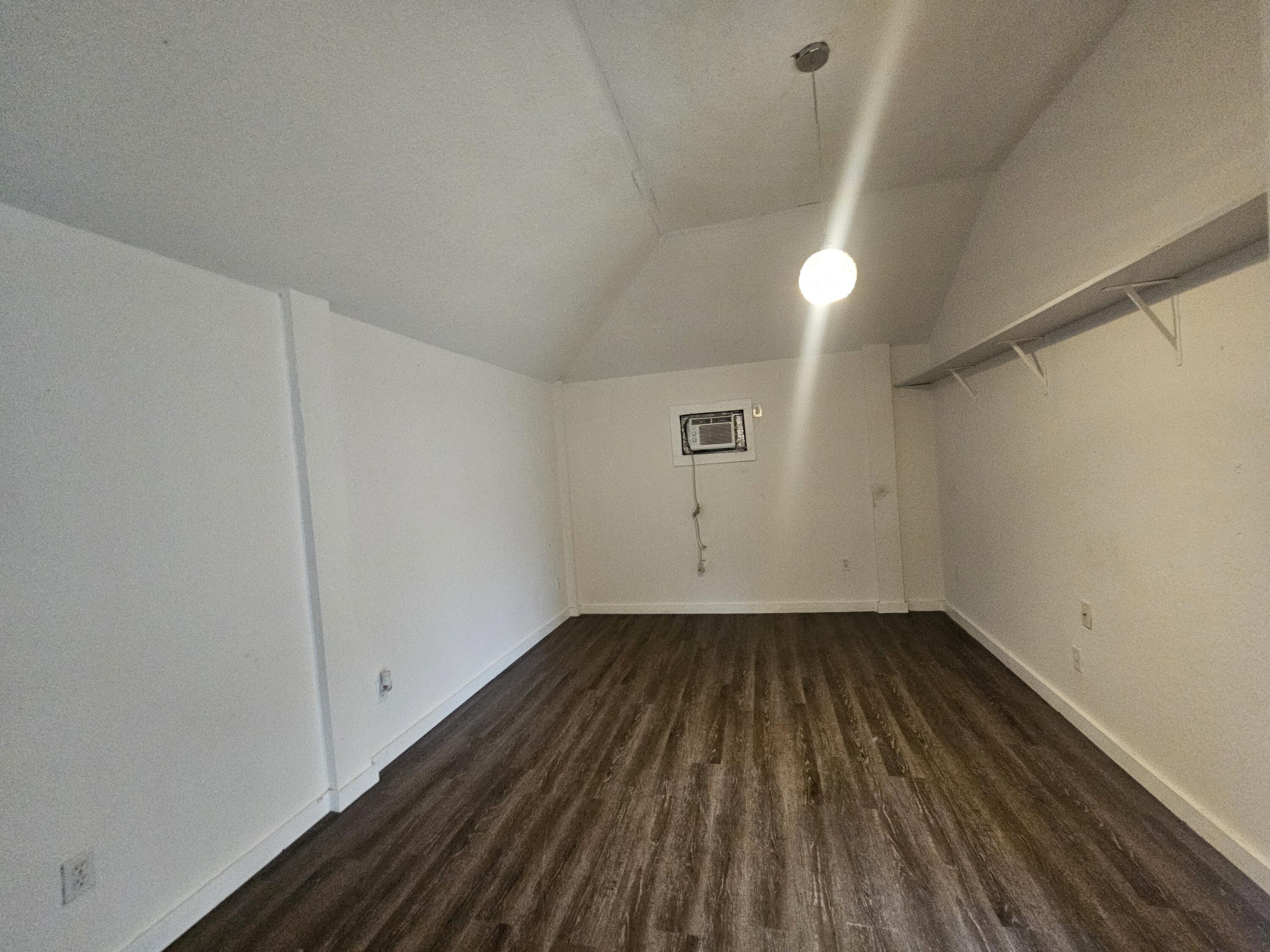 3215 Southeast Pinto Street Port St. Lucie, FL 34984 - Photo 32 of 34 a view of a room with wooden floor and white walls