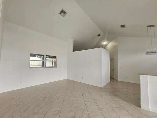 a view of an entryway with kitchen