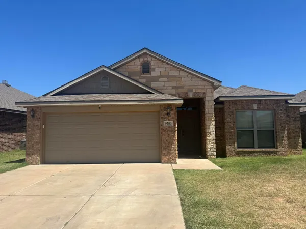 a front view of a house with a garage