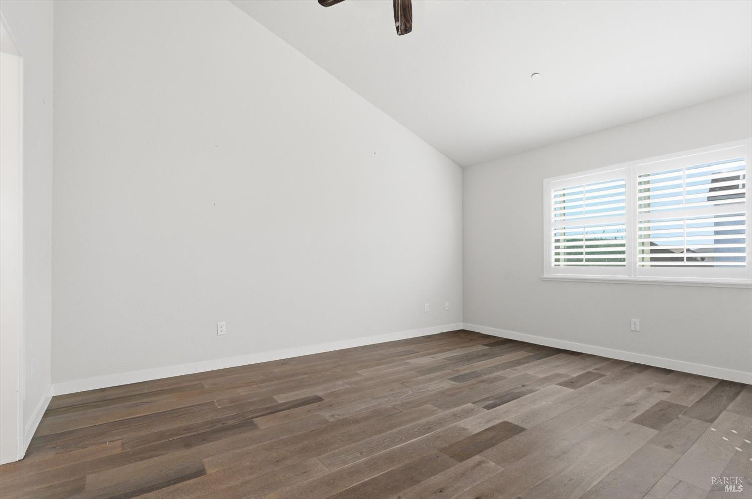 3769 Mocha Lane Santa Rosa, CA 95403 - Photo 12 of 38 a view of an empty room with wooden floor and a window