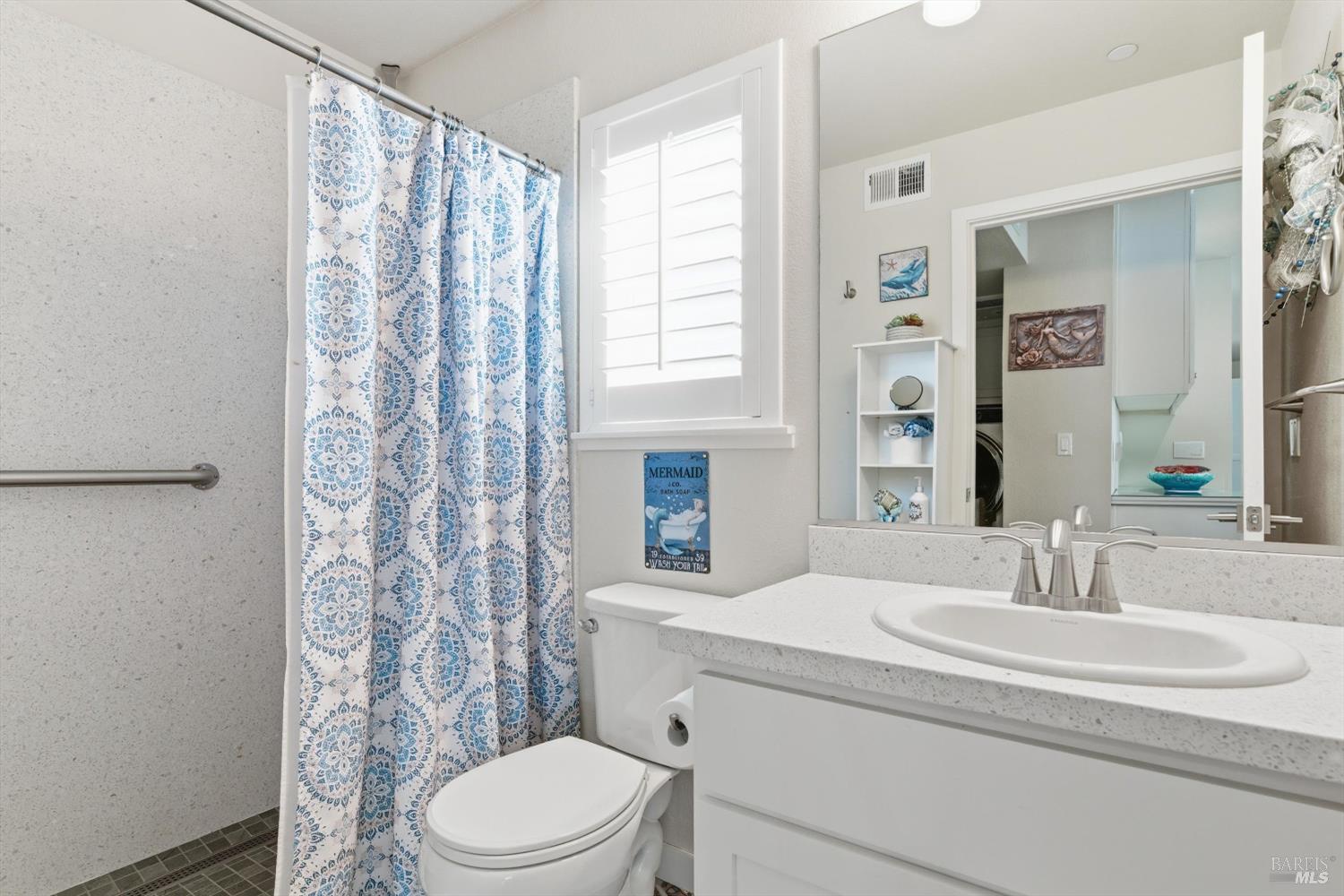 3769 Mocha Lane Santa Rosa, CA 95403 - Photo 15 of 38 a bathroom with a sink a toilet and shower curtain