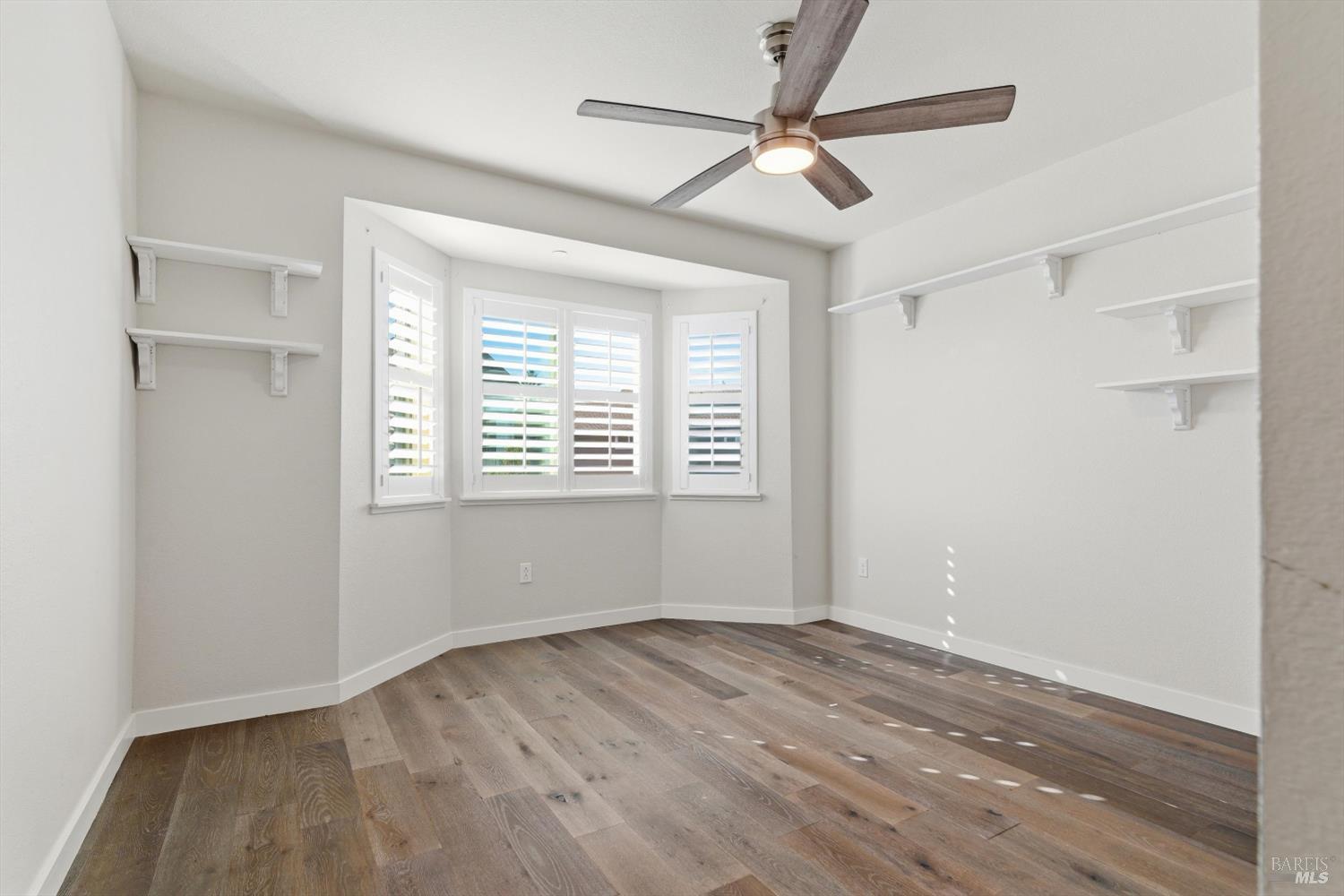 3769 Mocha Lane Santa Rosa, CA 95403 - Photo 19 of 38 a view of empty room with wooden floor and fan