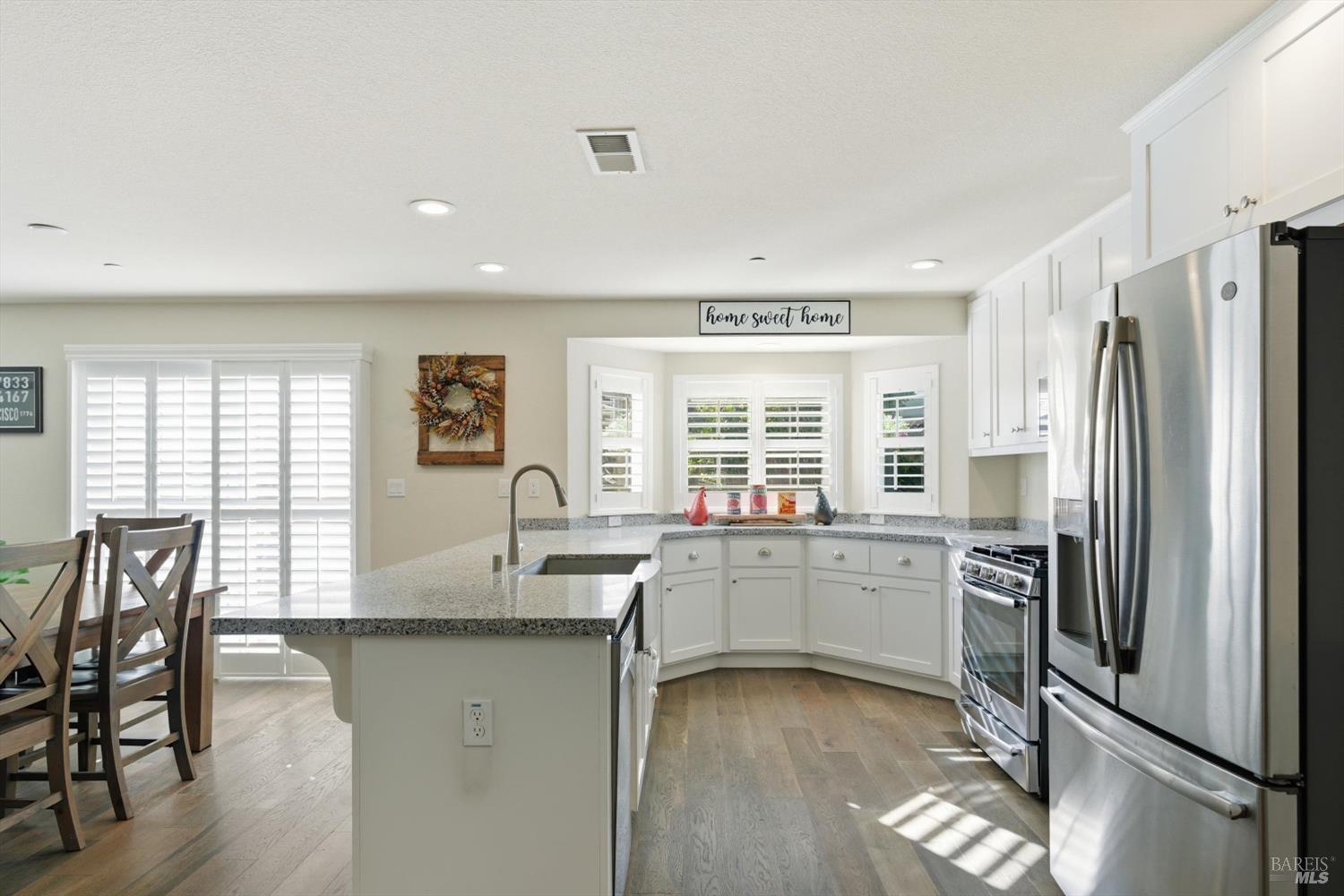 3769 Mocha Lane Santa Rosa, CA 95403 - Photo 2 of 38 a kitchen with stainless steel appliances granite countertop a refrigerator and a stove top oven