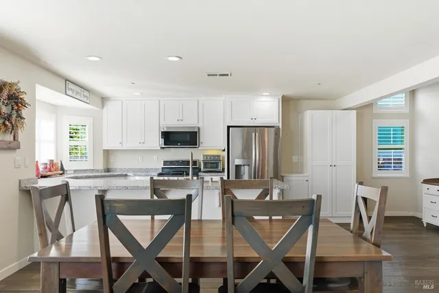a view of a dining room with furniture