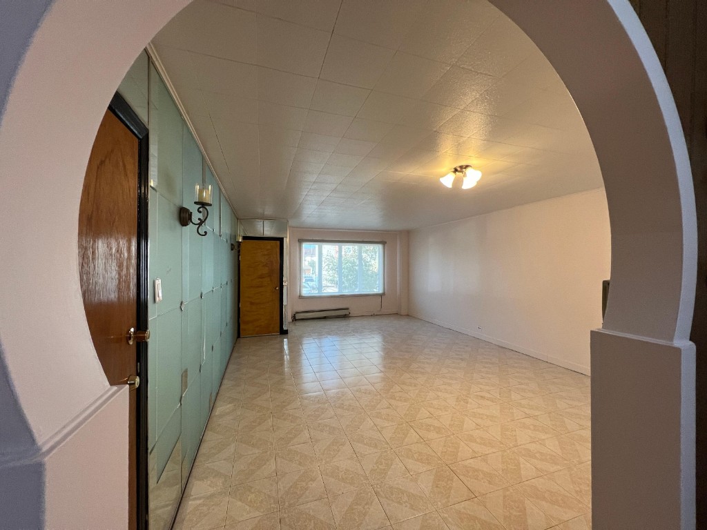 1114 Bay Ridge Parkway Brooklyn, NY 11228 - Photo 2 of 7 an empty room with windows and entrance