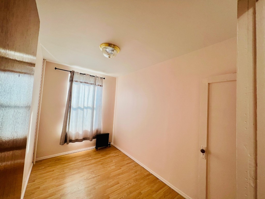 1114 Bay Ridge Parkway Brooklyn, NY 11228 - Photo 5 of 7 a view of empty room with wooden floor