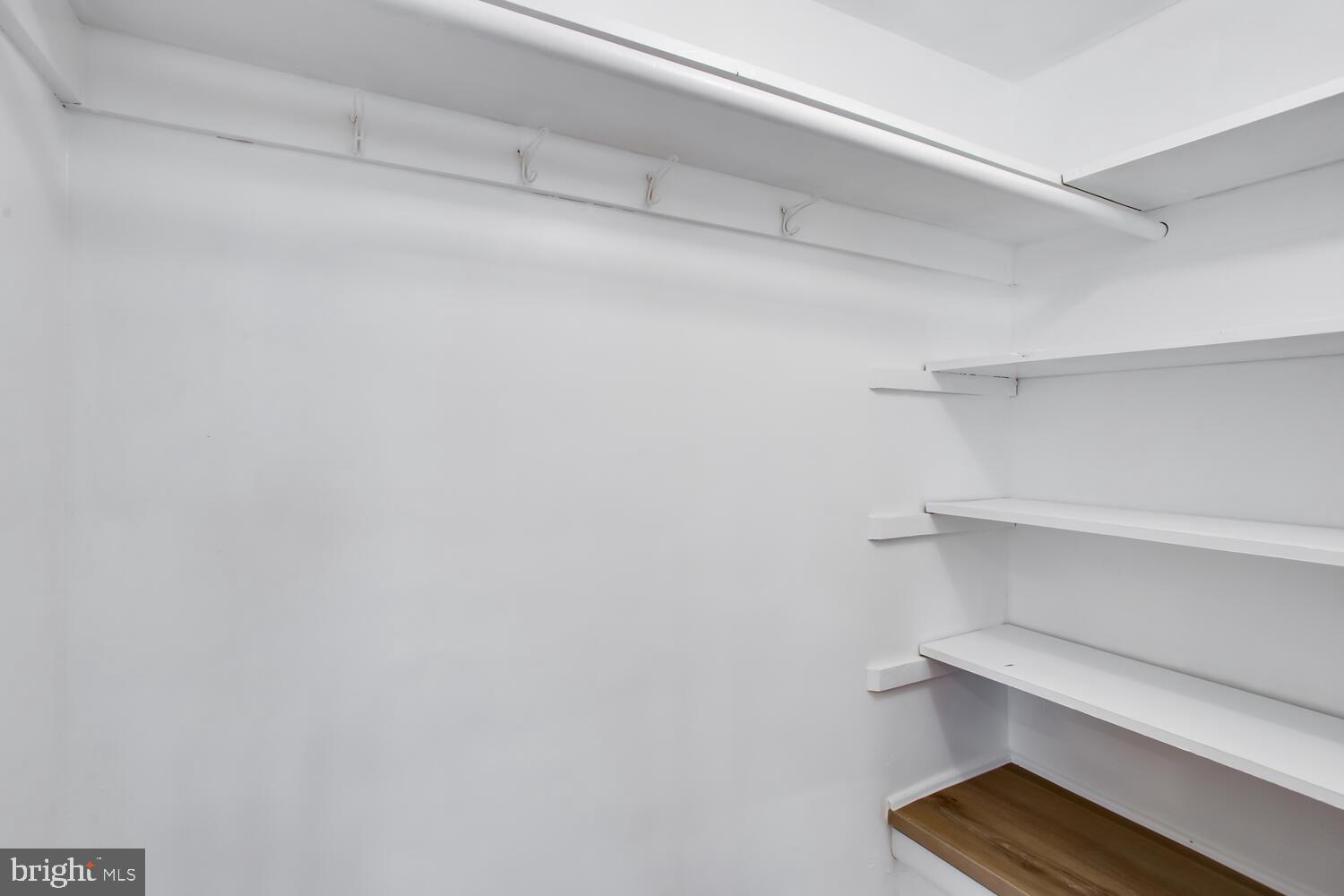 4803 Bass Place Southeast Washington, DC 20019 - Photo 14 of 22 a view of room with racks on the wall