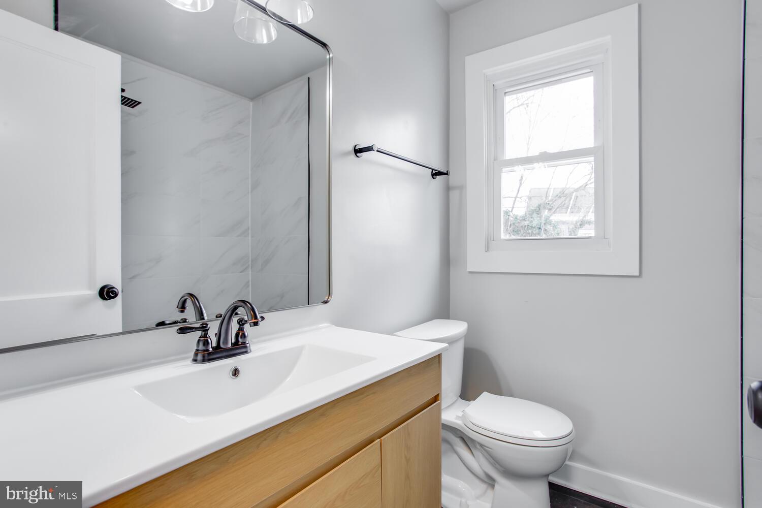 4803 Bass Place Southeast Washington, DC 20019 - Photo 17 of 22 a bathroom with a sink and a toilet