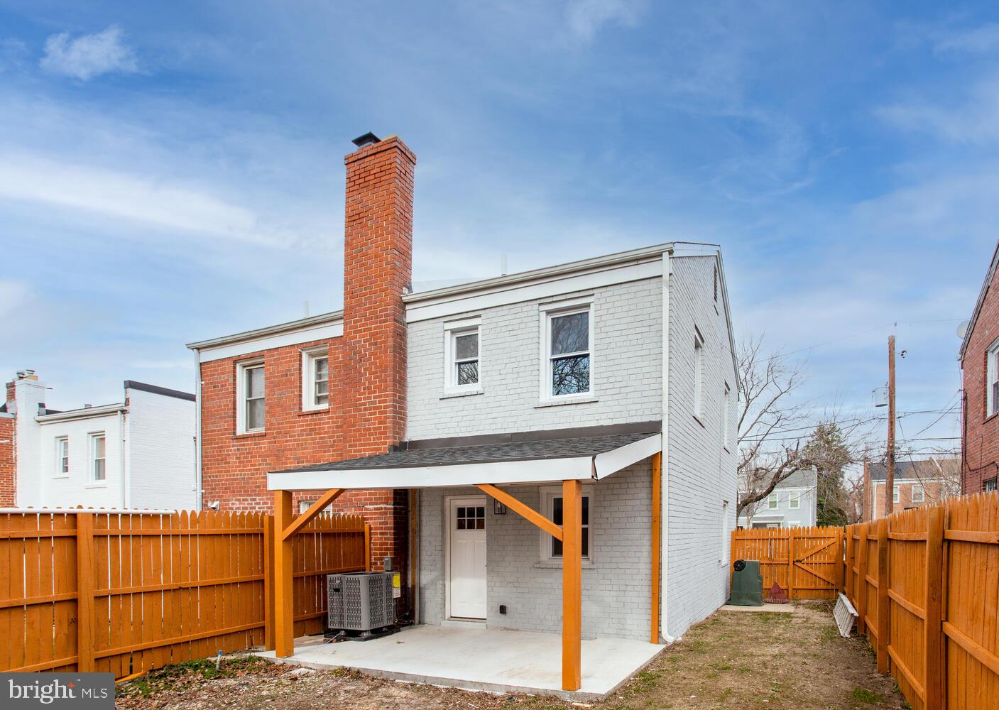 4803 Bass Place Southeast Washington, DC 20019 - Photo 20 of 22 a front view of a house with a yard
