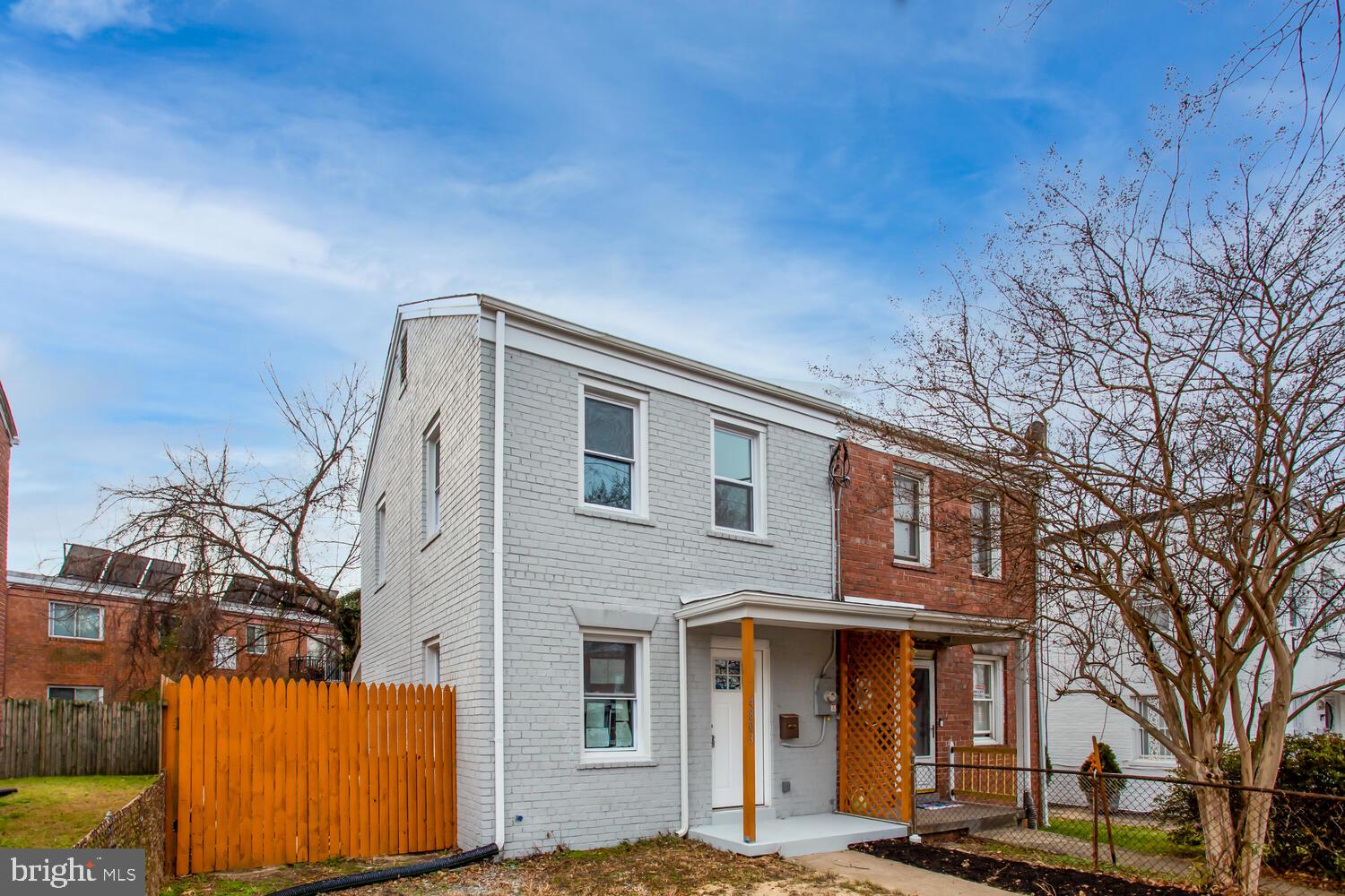 4803 Bass Place Southeast Washington, DC 20019 - Photo 2 of 22 a front view of a house with a yard