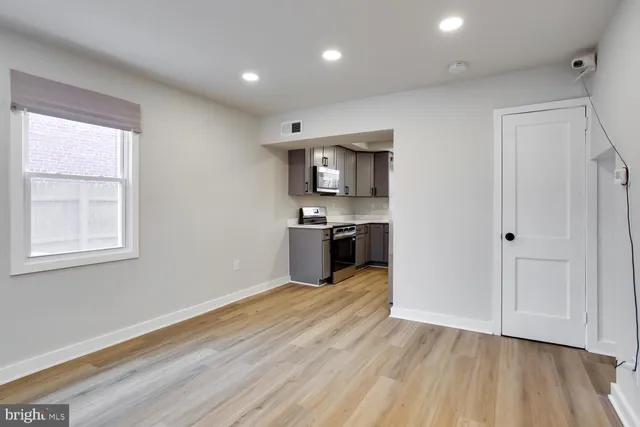 a view of a kitchen with microwave and stove