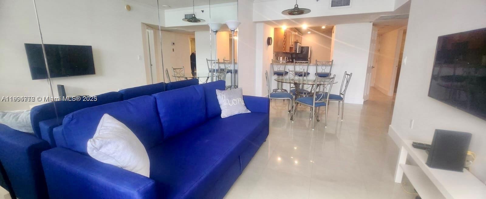 100 Lincoln Road, Unit 1626 Miami Beach, FL 33139 - Photo 1 of 43 a living room with furniture and a flat screen tv