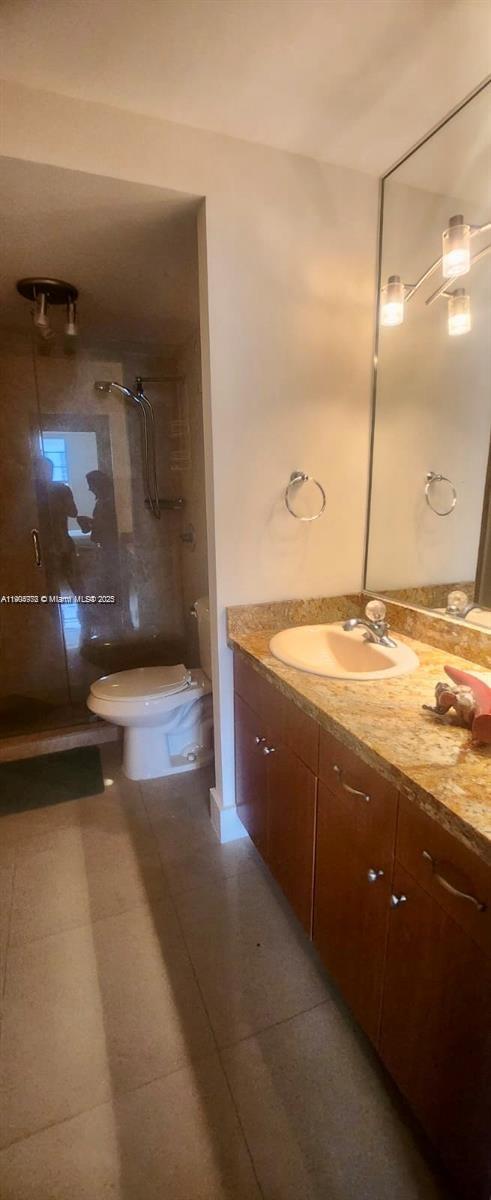 100 Lincoln Road, Unit 1626 Miami Beach, FL 33139 - Photo 27 of 43 a view of a bathroom with a sink and mirror