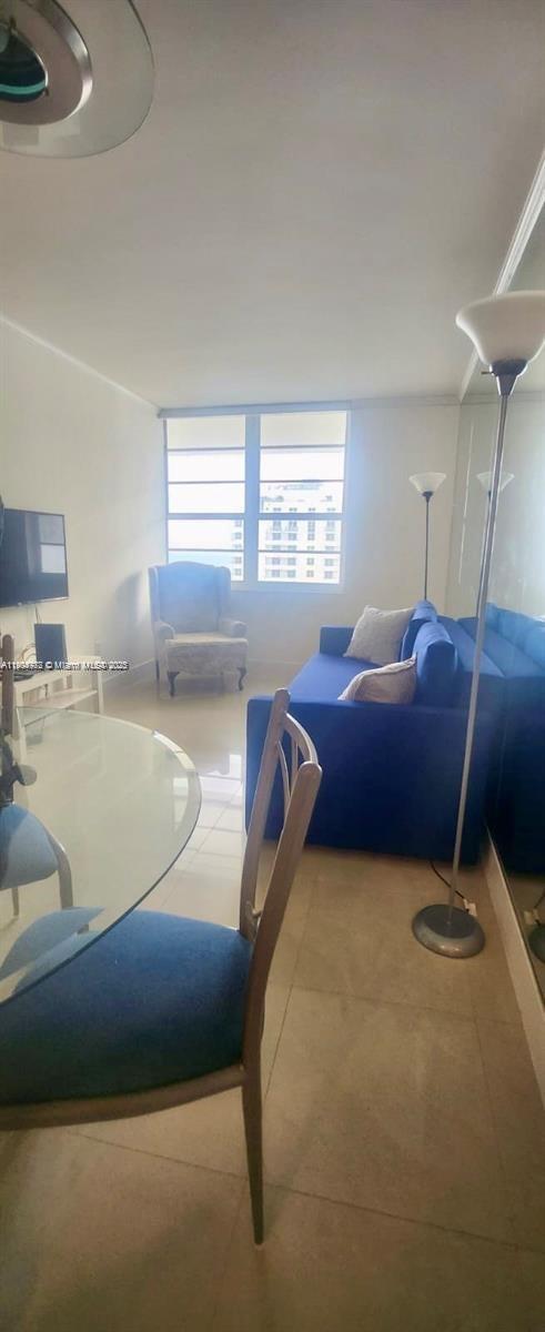 100 Lincoln Road, Unit 1626 Miami Beach, FL 33139 - Photo 29 of 43 a living room with a bed furniture and a window