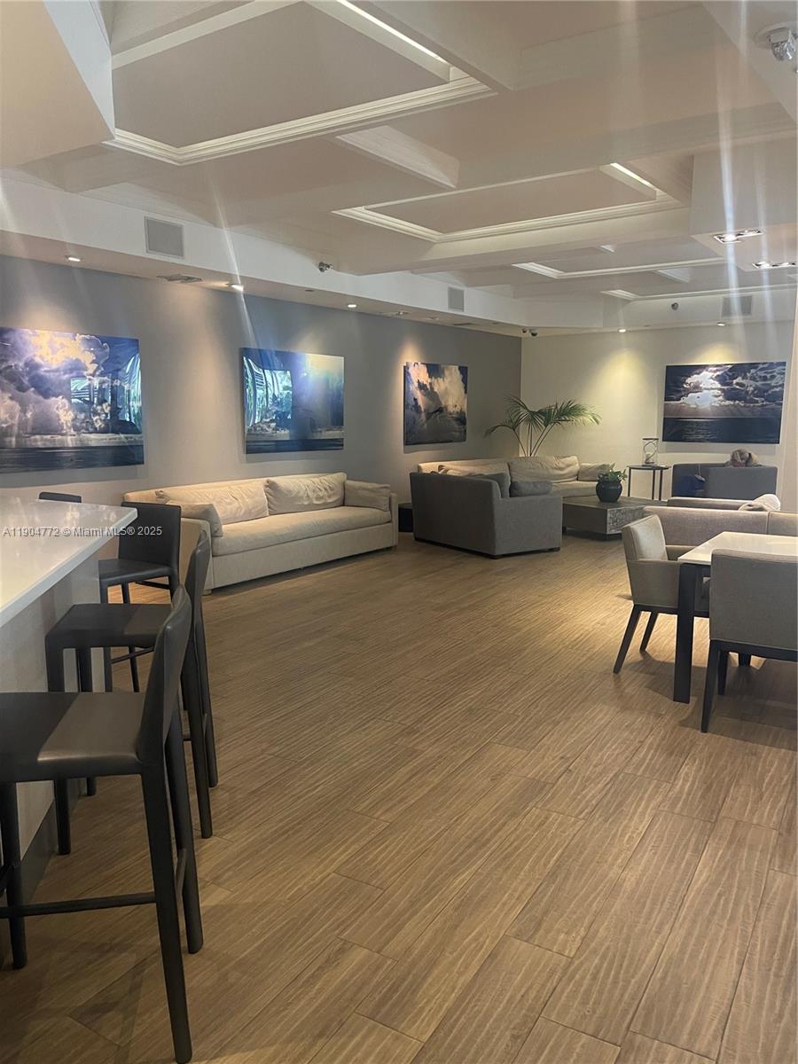 100 Lincoln Road, Unit 1626 Miami Beach, FL 33139 - Photo 40 of 43 a living room with furniture and a wooden floor