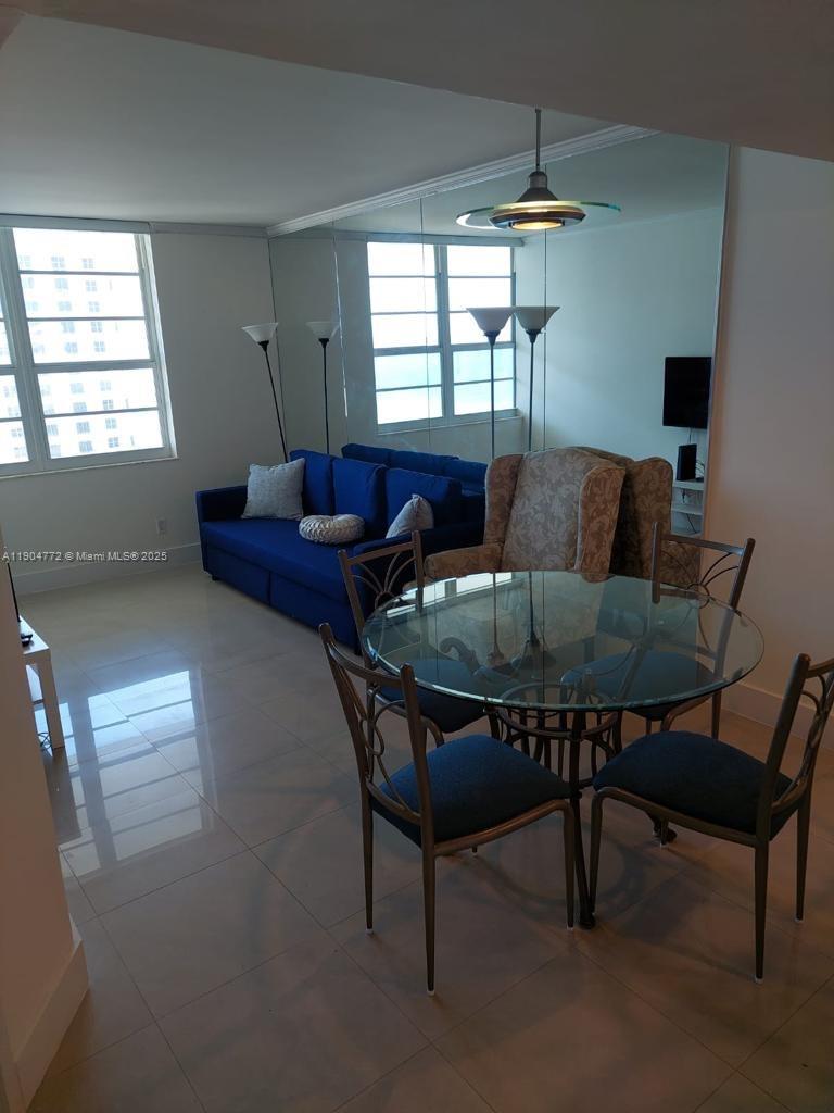 100 Lincoln Road, Unit 1626 Miami Beach, FL 33139 - Photo 10 of 43 a living room with furniture and a window