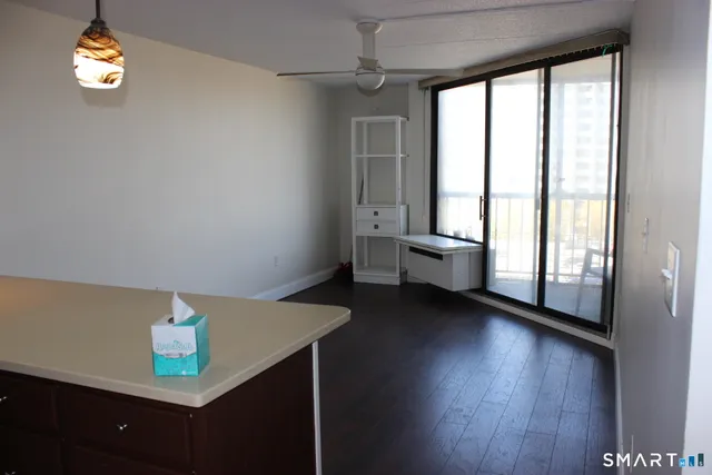 a view of an empty room with a window