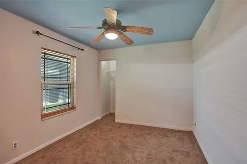 a room with furniture and a large window