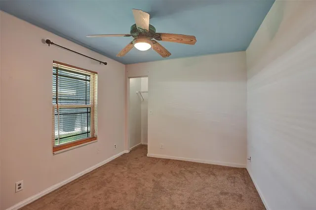 a room with furniture and a large window