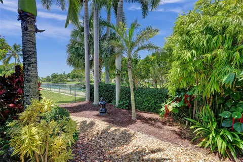a view of a garden with a lake view
