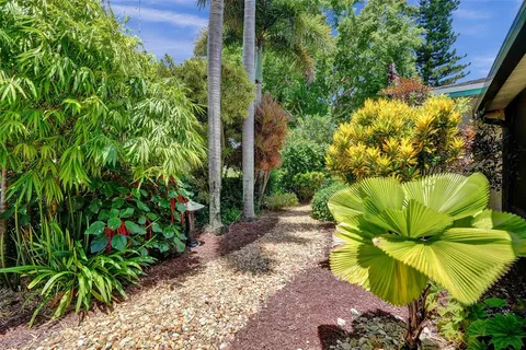 a view of a lake with houses in the background