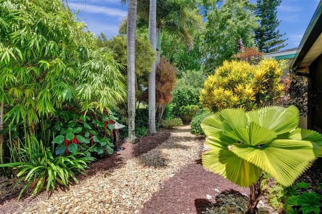 a view of a lake with houses in the background
