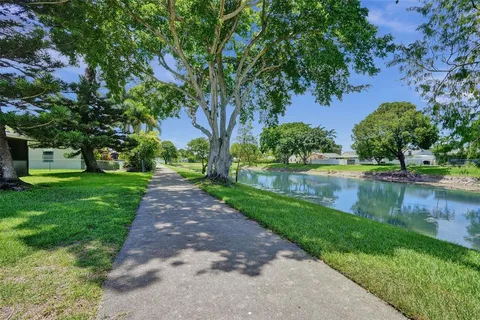 a view of a lake with a houses in the background