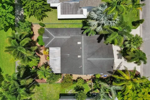 a view of a garden in front of a house