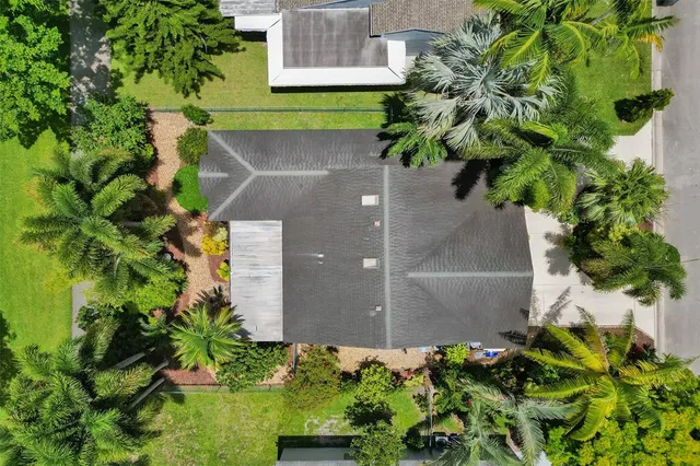 a view of a garden in front of a house