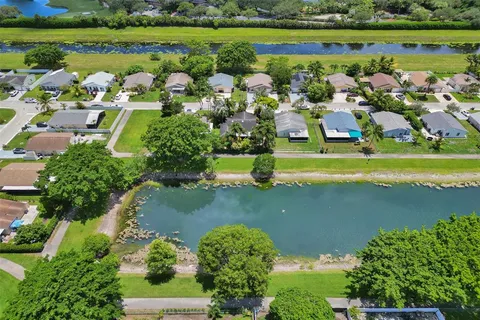 an aerial view of a city with lake view