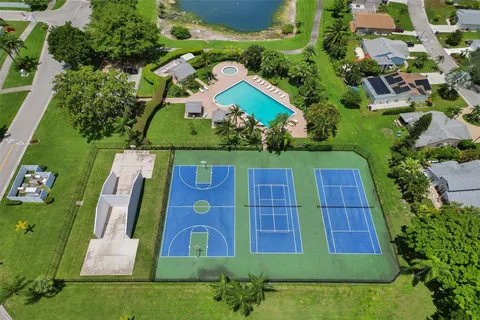 an aerial view of a pool yard and lake view
