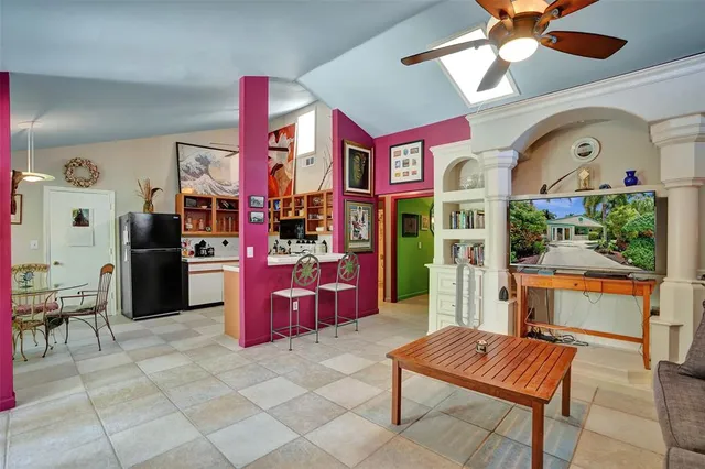 a dining room with furniture and window