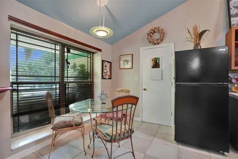a kitchen with stainless steel appliances granite countertop a stove and cabinets