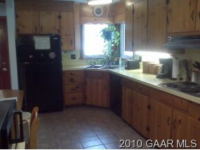 3610 Rockfish Road Grottoes, VA 24441 - Photo 3 of 9 a kitchen with granite countertop a sink and cabinets