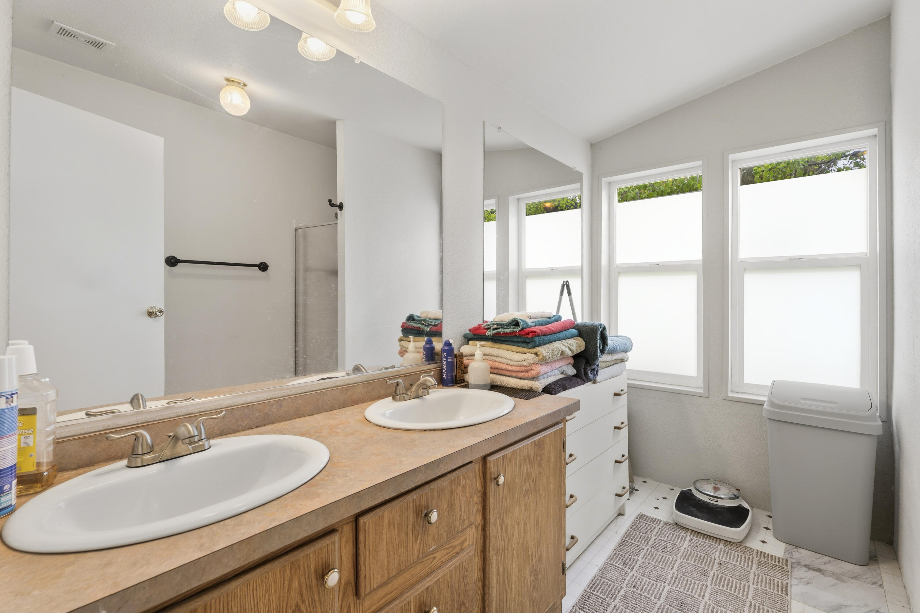 16928 Covina Road Bend, OR 97707 - Photo 25 of 48 a bathroom with a sink double vanity and a window