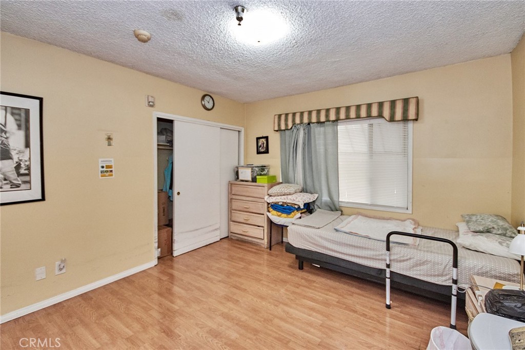 528 Howard Street Alhambra, CA 91801 - Photo 12 of 37 a bedroom with furniture and a window