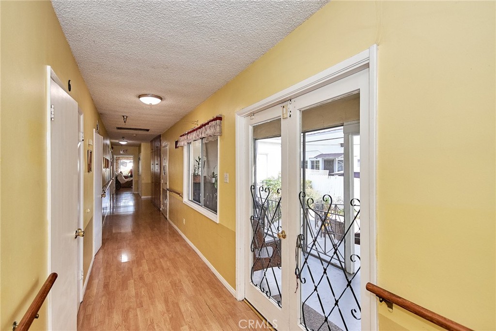 528 Howard Street Alhambra, CA 91801 - Photo 15 of 37 a view of a hallway with wooden floor and windows