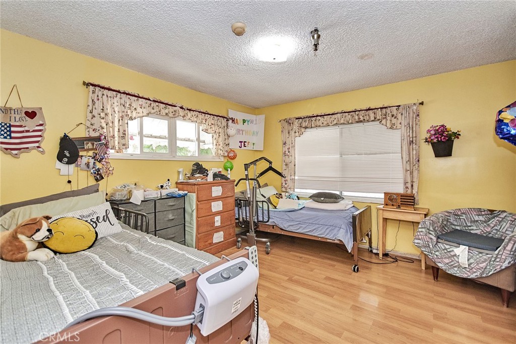 528 Howard Street Alhambra, CA 91801 - Photo 22 of 37 a bedroom with furniture and a window