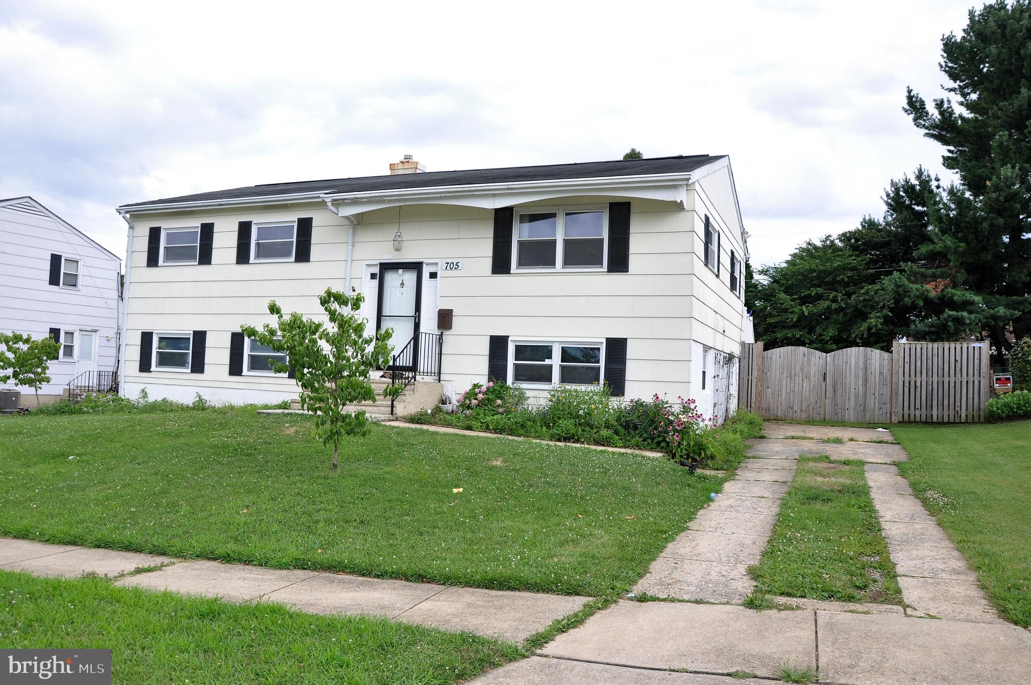 705 Crosby Road Baltimore, MD 21228 - Photo 1 of 37 a front view of house with yard and green space