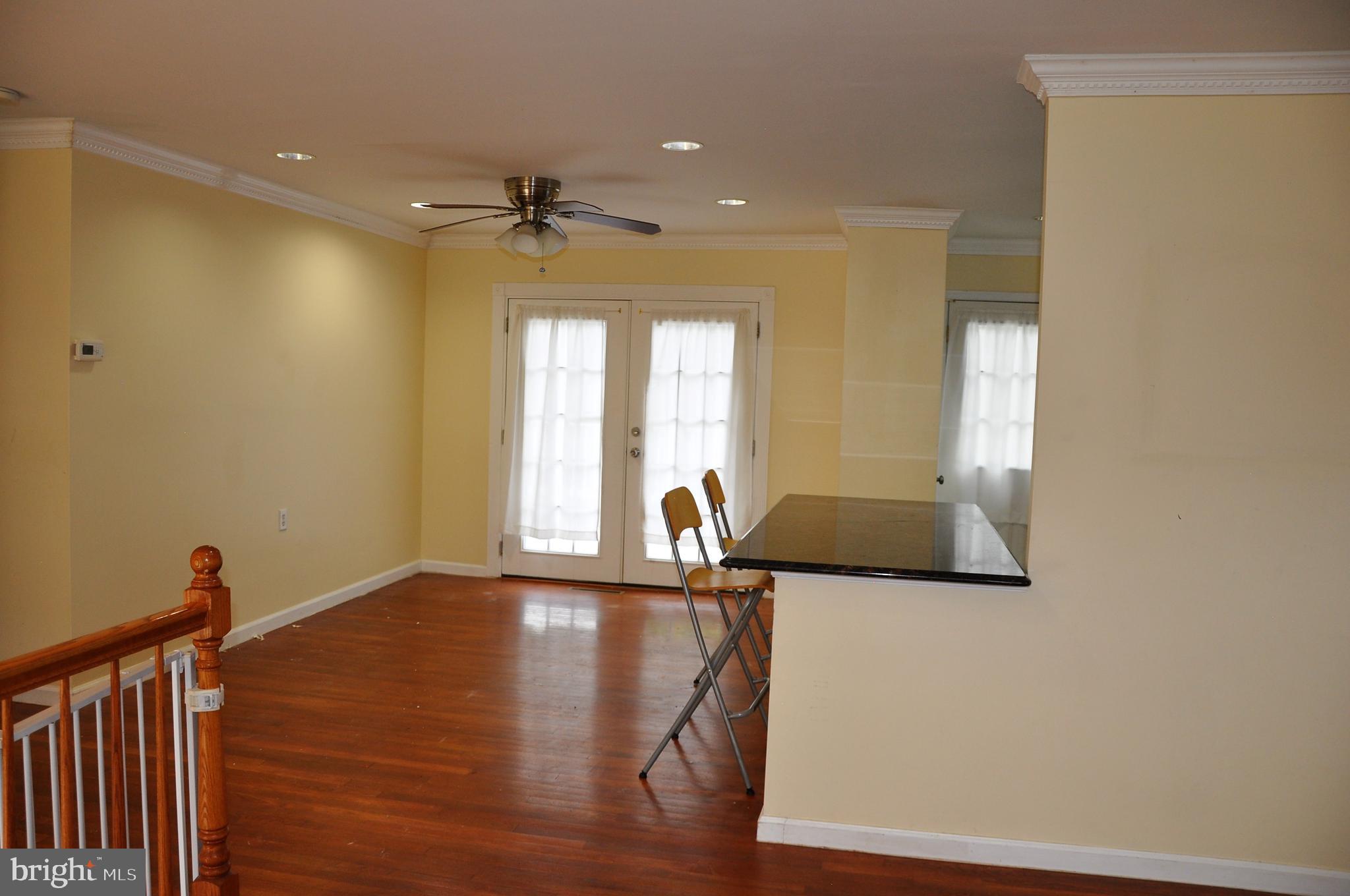 705 Crosby Road Baltimore, MD 21228 - Photo 11 of 37 a view of a hallway with a chandelier