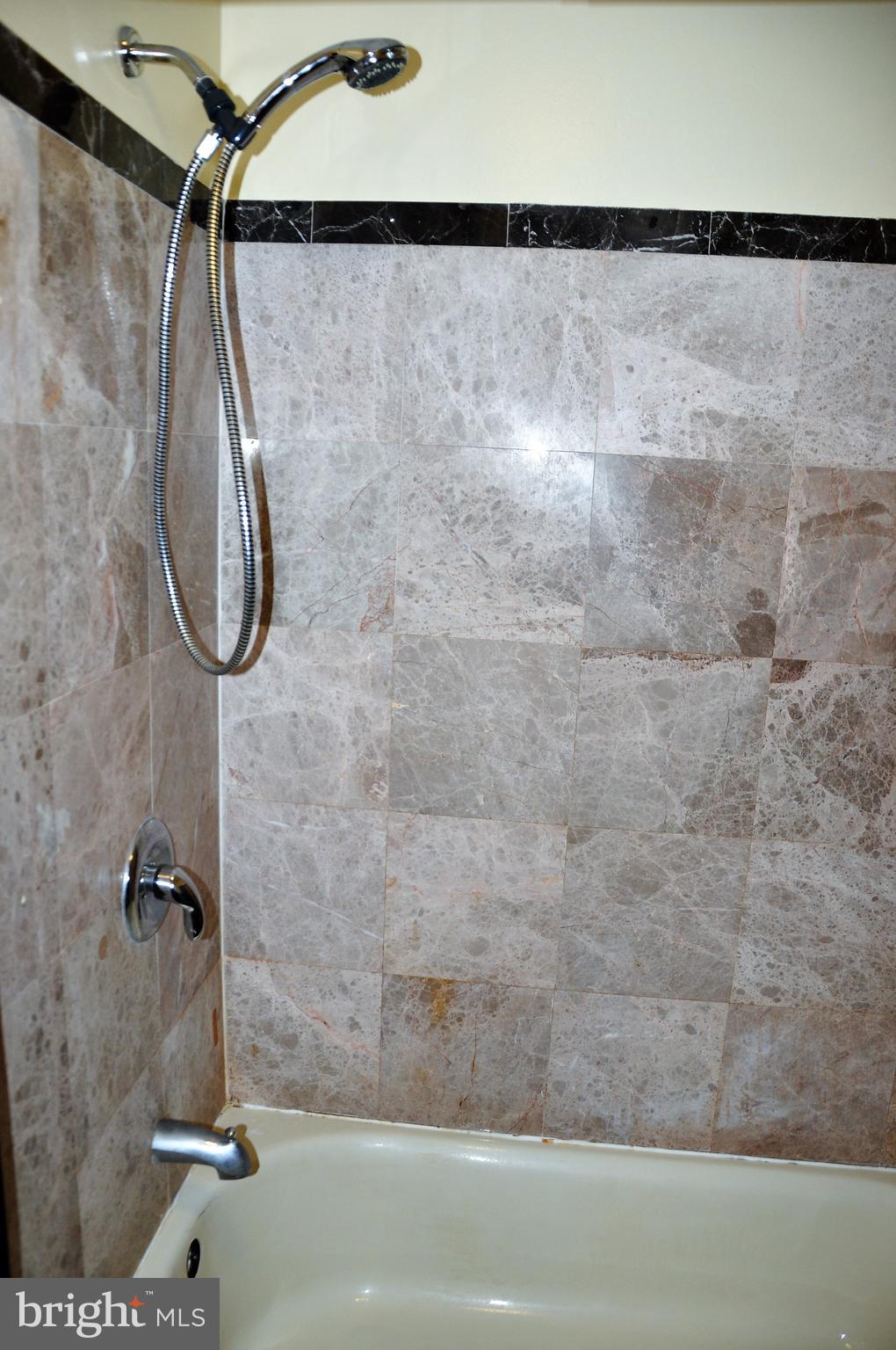 705 Crosby Road Baltimore, MD 21228 - Photo 14 of 37 a bathroom with a shower