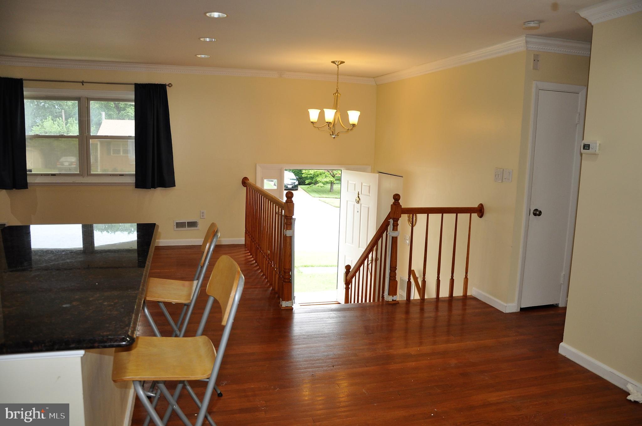 705 Crosby Road Baltimore, MD 21228 - Photo 21 of 37 a view of a hallway with furniture and wooden floor