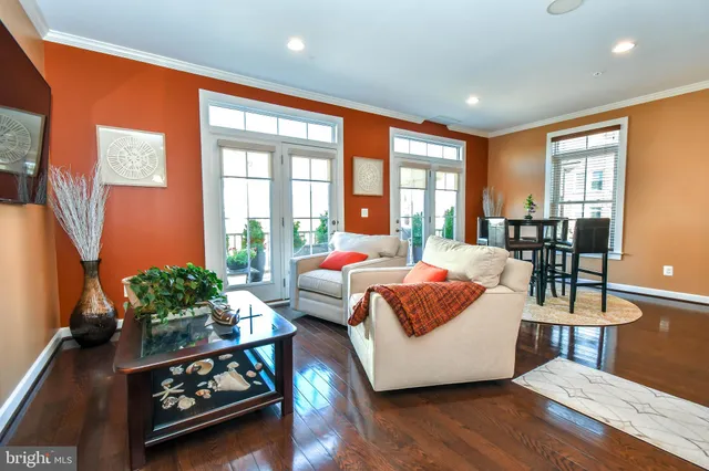 a spacious bedroom with a bed couch and a large window