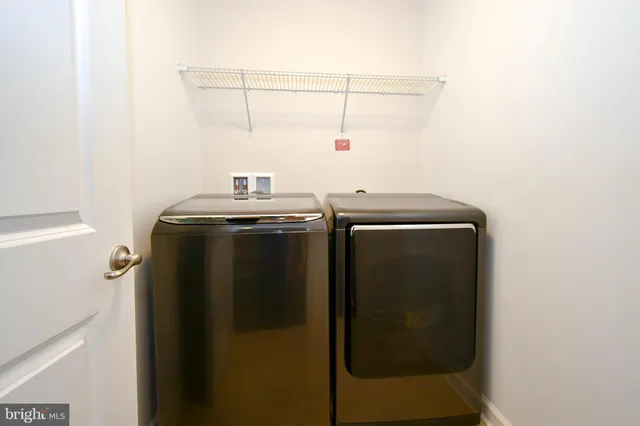 a utility room with dryer and washer