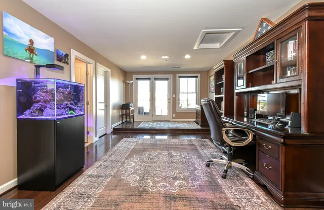 a view of a hallway with a livingroom with furniture