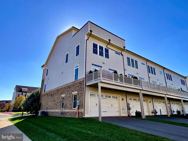 a front view of a building with a yard