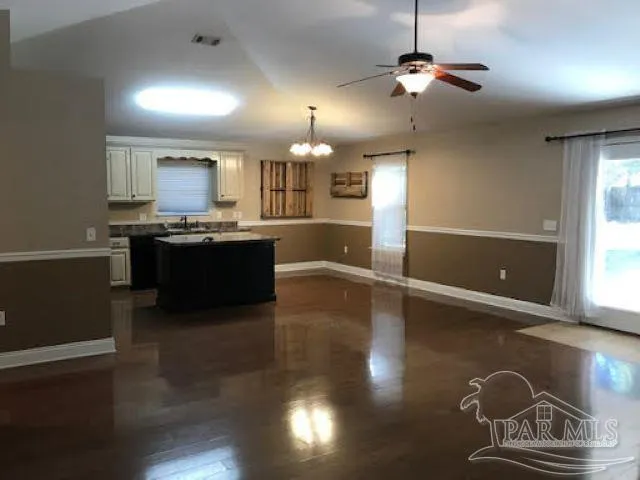 a view of a yard with large trees
