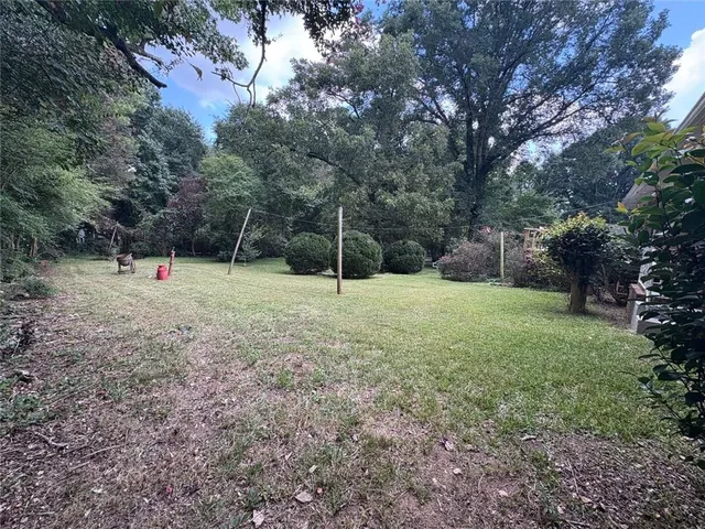 a view of outdoor space with deck and tree